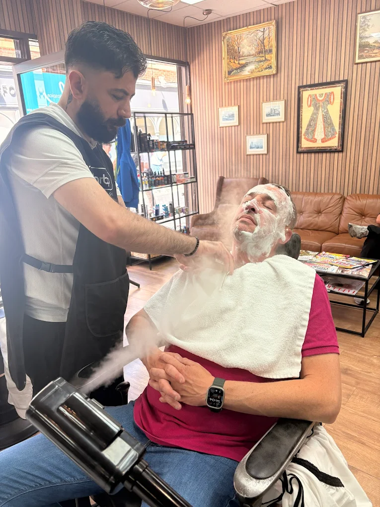 Hot towel shave and facial treatment at The Antique Barbers.